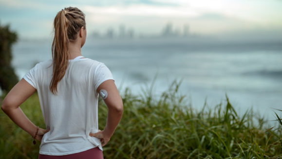 Diabetes woman ready for morning run along the coast