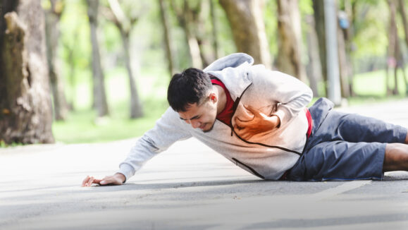 Asian,Cardiac,Arrest,Running,Young,Man,Heart,Attack,In,Park.severe