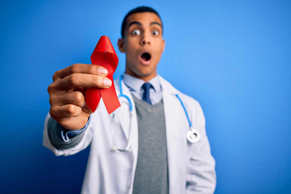 Young,Handsome,African,American,Doctor,Man,Holding,Red,Hiv,Ribbon