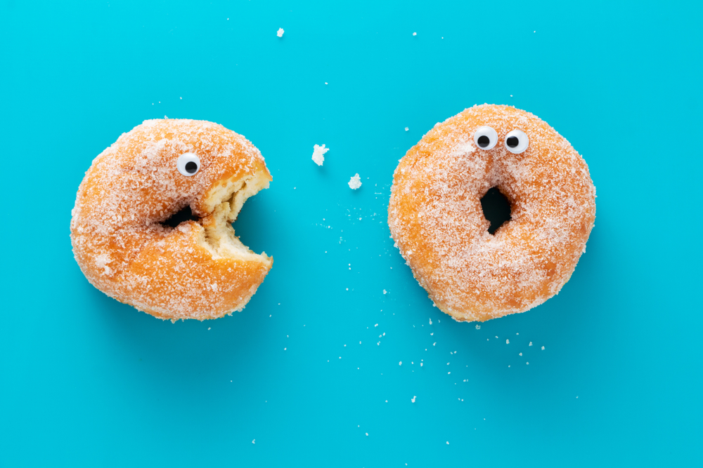 Funny,Doughnuts,With,Eyes,,Cartoon,Like,Characters,,On,Blue,Background.