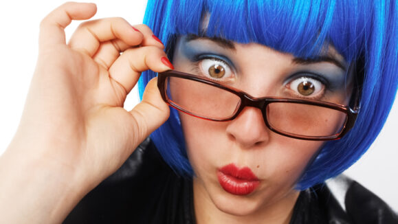 Girl,With,Blue,Wig,And,Glasses,Looking,Astonished