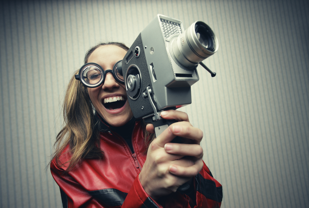 Nerdy,Woman,Using,Old,Fashioned,Cine,Camera