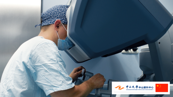 A picture with surgeon operates a robotic surgical system, with the logo of Zhongshan Ophthalmic Center of Sun Yat-sen University and China flag